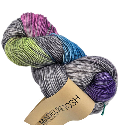 Image of a single hank of Tosh Merino Light Yarn by Madelinetosh in the color Night Hawk with label on a white background.