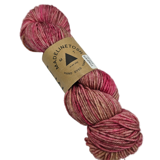 Image of a single hank of Tosh Vintage yarn by Madelinetosh in the color Fragrant with label on a white background.