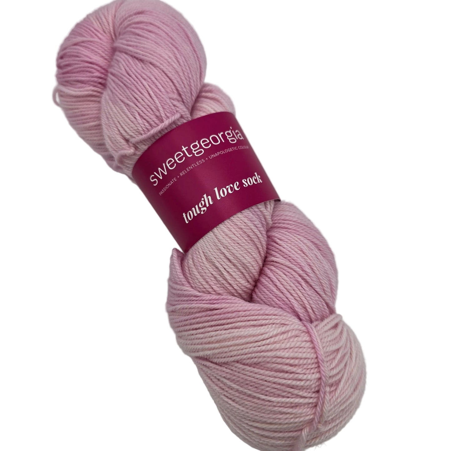 Image of a single skein of Tough Love Sock by SweetGeorgia Yarns in the color Candy Floss with label on a white background.