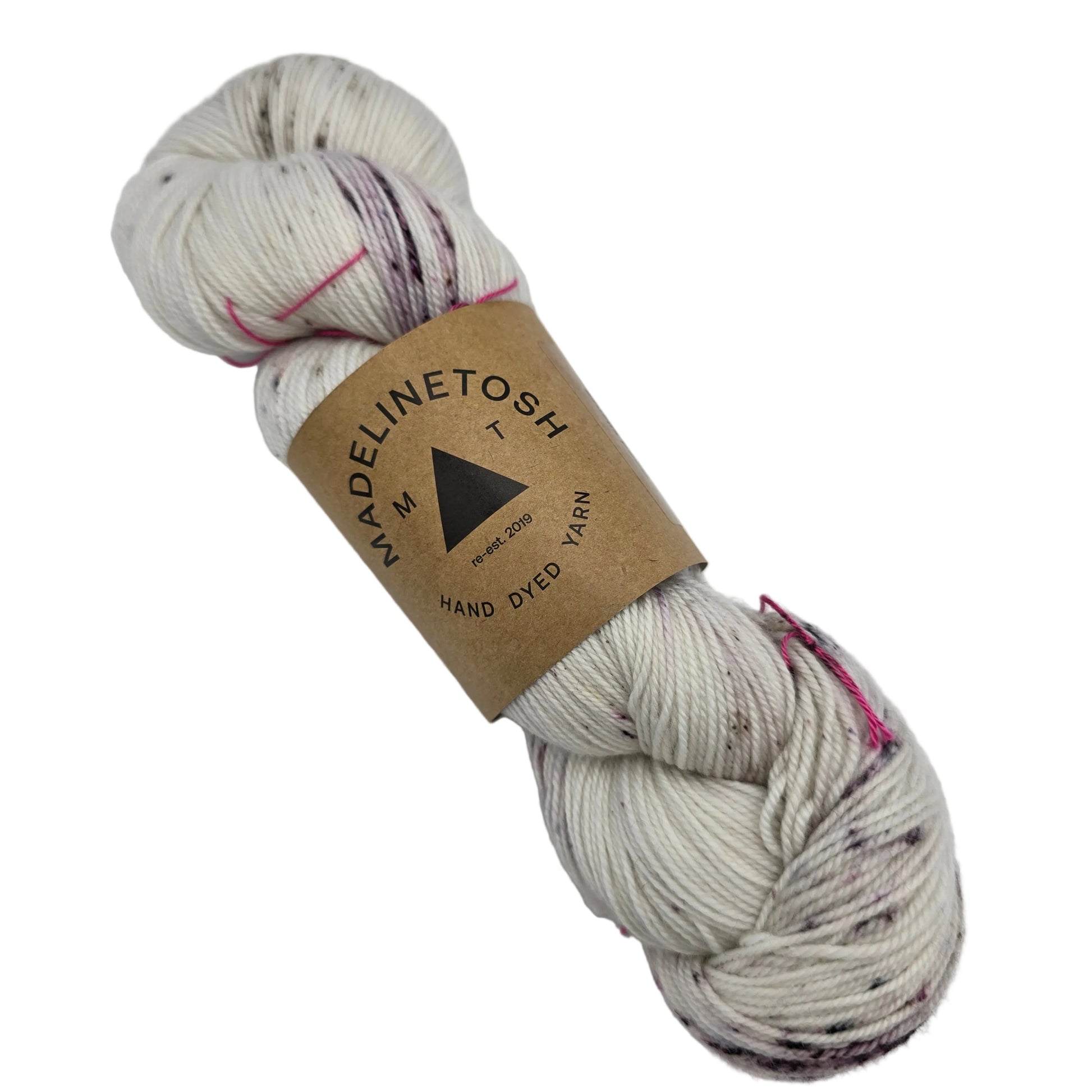 Image of a single hank of Twist Light yarn by Madelinetosh  in the color Good Silence with label on a white background.