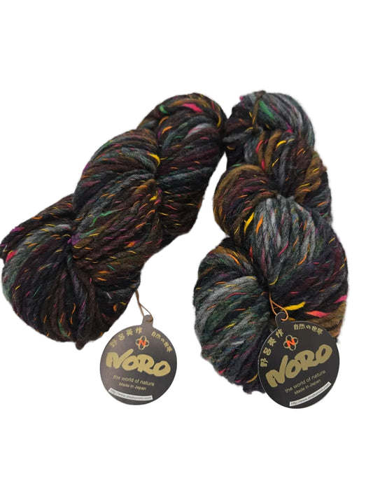 Two skeins of Yoroi Yarn by Noro in color 2 with label on a white background.