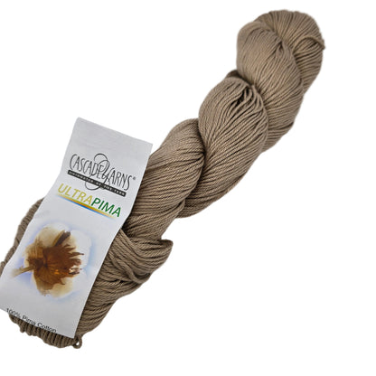 Image of a single skein of Ultra_Pima_Yarn by_Cascade_-_Color_3717 _Beige with label on a white background.