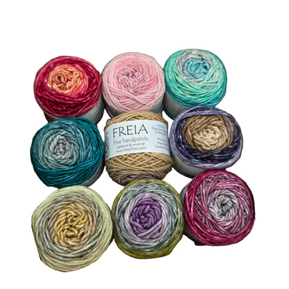 Image of 9 mini skeins of yarn in multiple difference colors from Minikins Zaizan Scarf Pack by Freia in the color selection Baby's Breath on a white background.