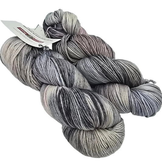 two skeins of color number 2, Fog valley superwash DK yarn by manos del Uruguay and Valley Yarns on a white background with label.