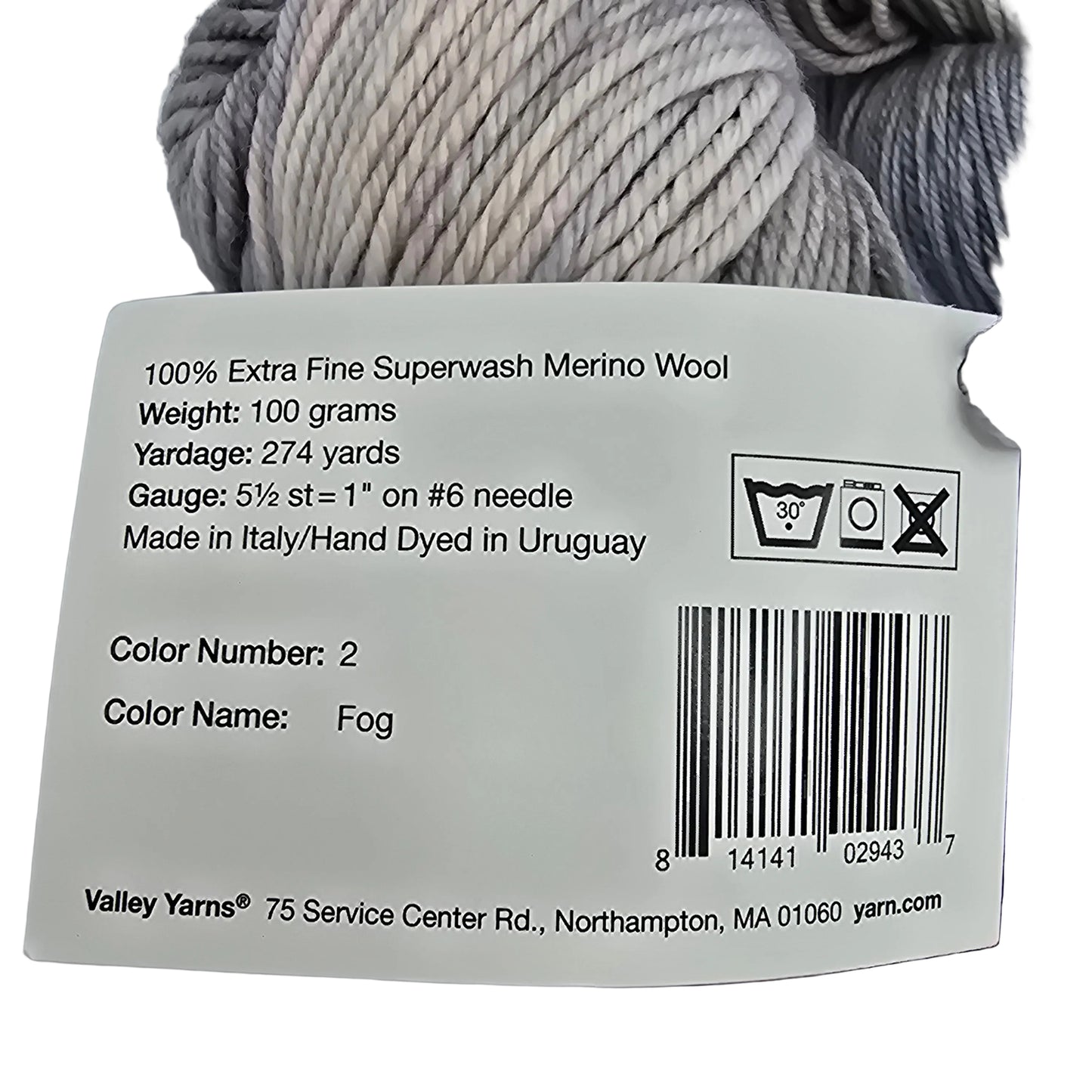 Close-up of label of color number 2, fog by valley superwash DK yarn by manos del Uruguay and Valley Yarns on a white background.