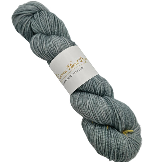 Image of a single skin of William DK Merino Yarn By Canon Hand Dyed inthe color Meg Little Women with label on a white background.
