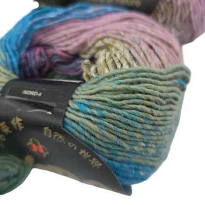 Close-up image of Aya Yarn by Noroin Color 2 with partial label on white background.