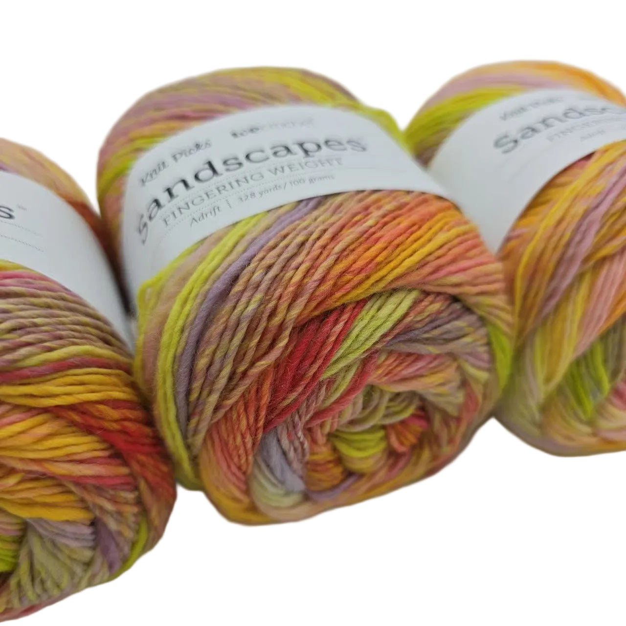 Close-up Image of cakes of Knit Picks Sandscapes in the color Adrift with labels on a white background.